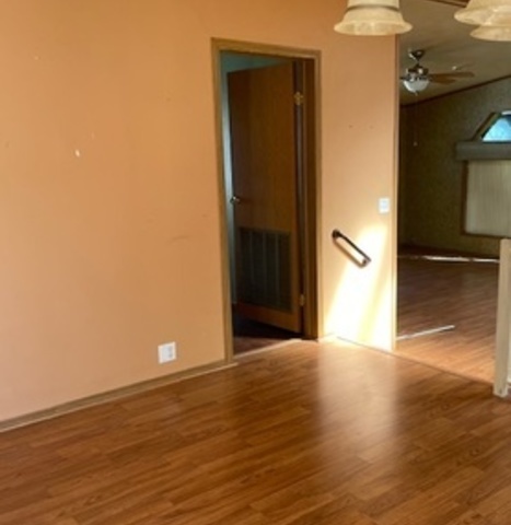 895 Cherry Street Manteno, IL 60950 - Photo 11 of 38 a view of a livingroom with wooden floor