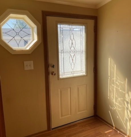 895 Cherry Street Manteno, IL 60950 - Photo 12 of 38 a view of entryway with wooden floor and a front door