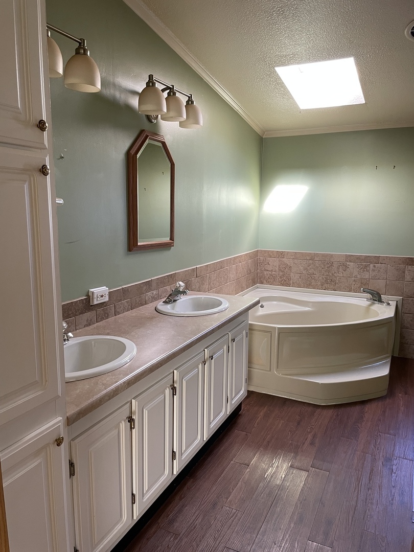 895 Cherry Street Manteno, IL 60950 - Photo 20 of 38 a bathroom with a double vanity sink and a mirror