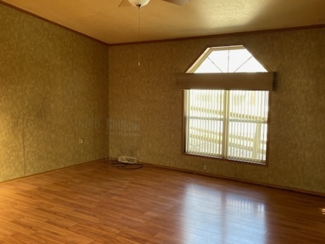 895 Cherry Street Manteno, IL 60950 - Photo 7 of 38 an empty room with wooden floor and windows