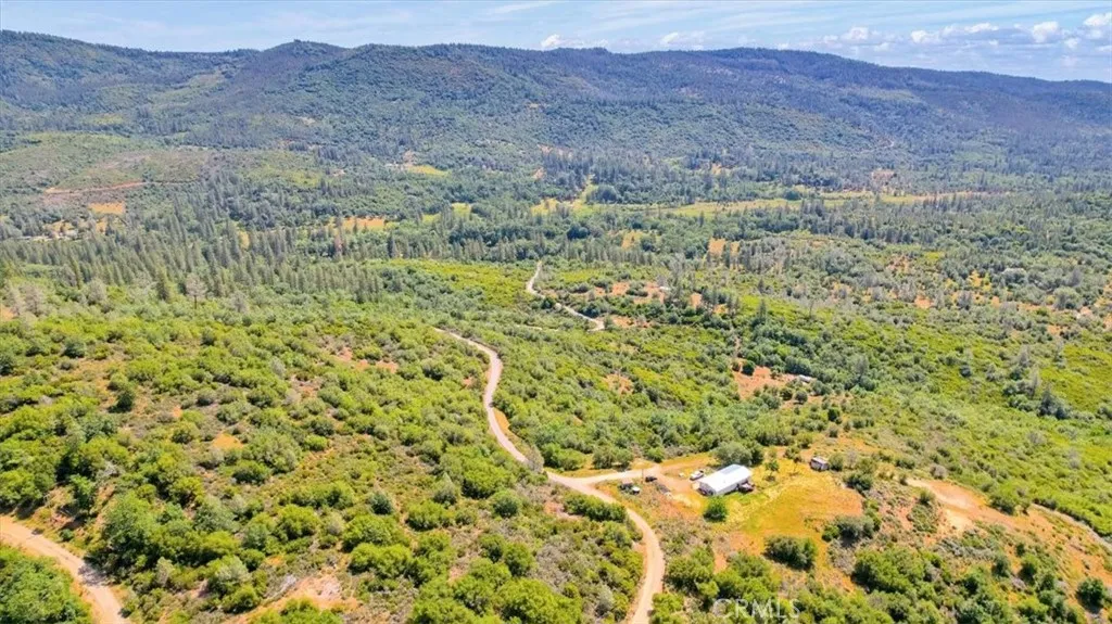 23 Clark Ranch Way Dobbins, CA 95935 - Photo 17 of 42 a view of a lush green hillside and a building