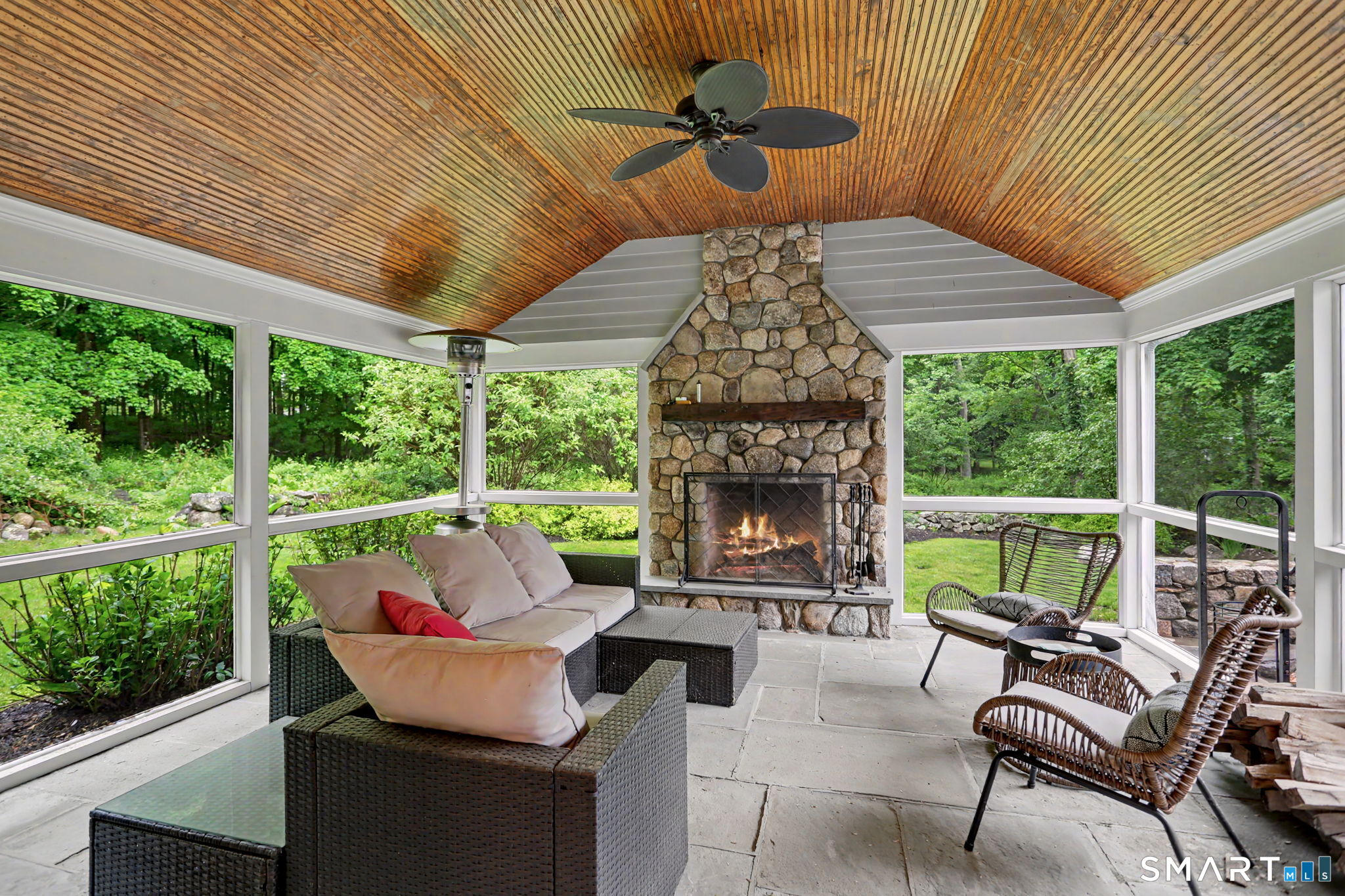 596 Silvermine Road New Canaan, CT 06840 - Photo 31 of 37 Wonderful screened in porch with tray ceiling and fan for summer relaxation and entertaining