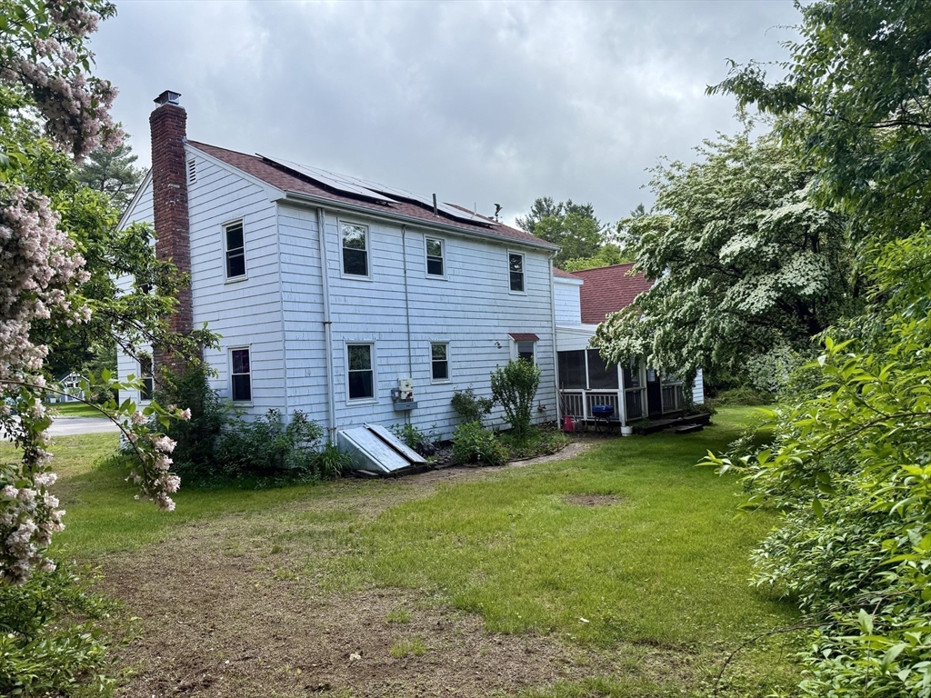 12 Clewes Road Millis, MA 02054 - Photo 14 of 14 a view of a house with a yard and plants