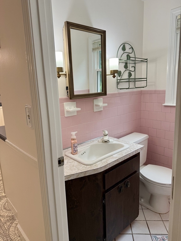 12 Clewes Road Millis, MA 02054 - Photo 9 of 14 a bathroom with a toilet sink and mirror