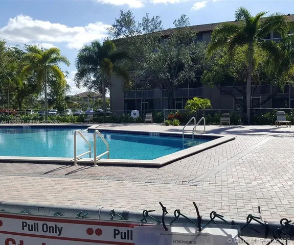 a view of a room with lots of gym equipment