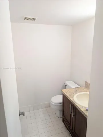 a bedroom with a bed and a night stand