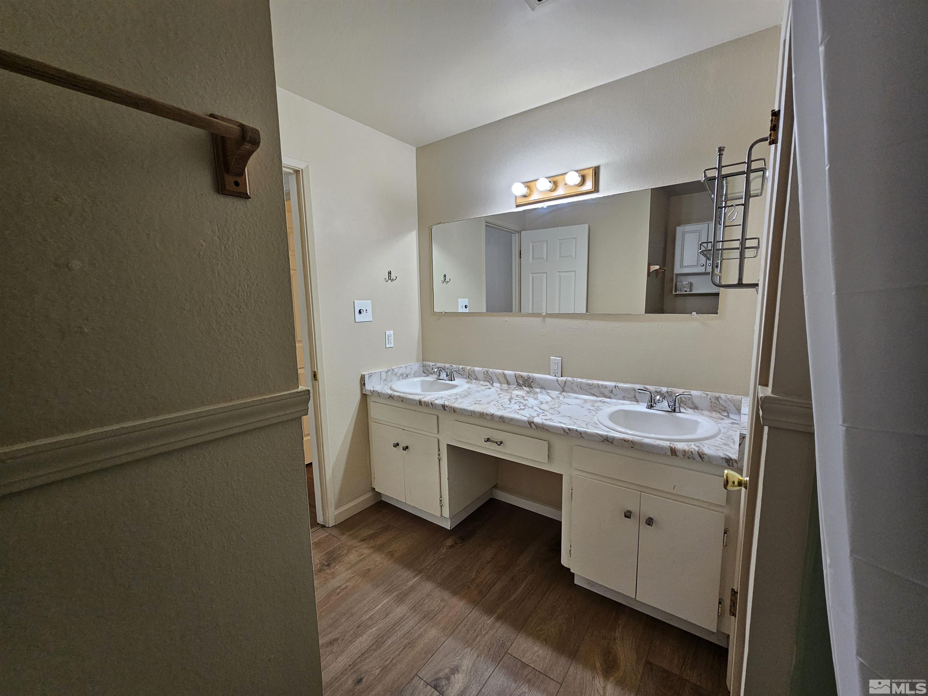 163 Smithridge Park Reno, NV 89502 - Photo 14 of 28 a bathroom with a granite countertop sink and a mirror