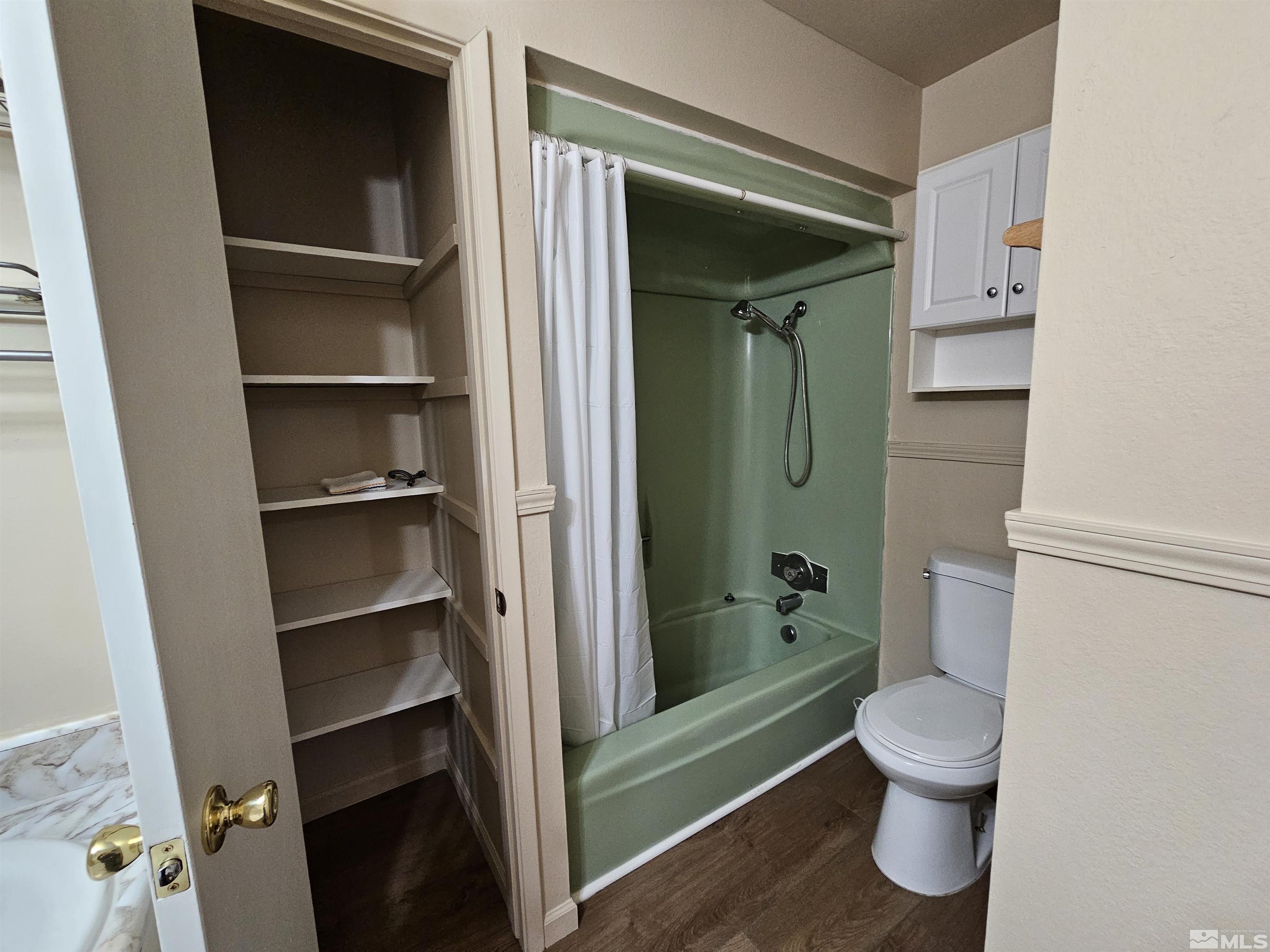 163 Smithridge Park Reno, NV 89502 - Photo 16 of 28 a bathroom with a toilet and a shower