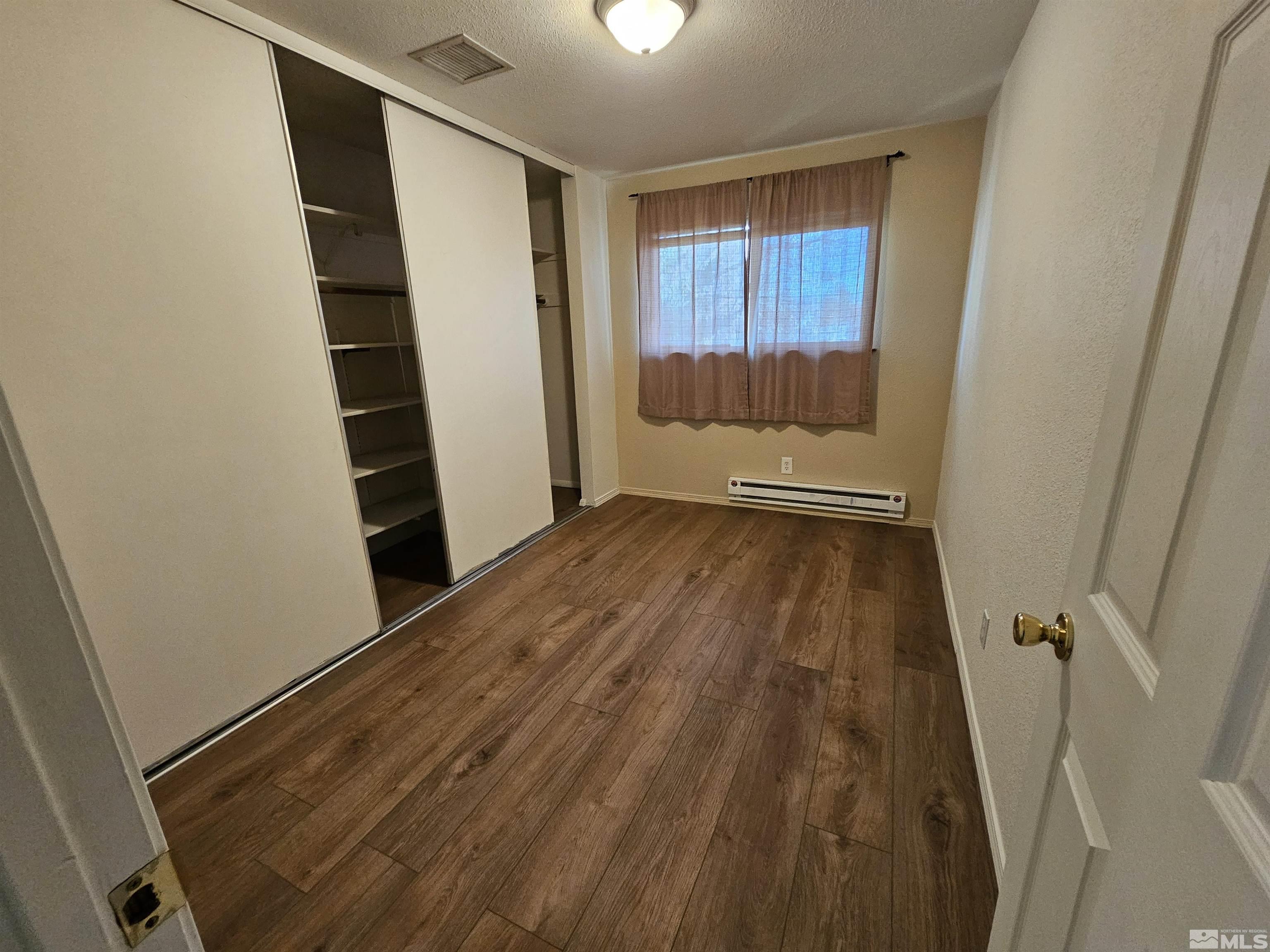 163 Smithridge Park Reno, NV 89502 - Photo 18 of 28 a view of a room with wooden floor and staircase