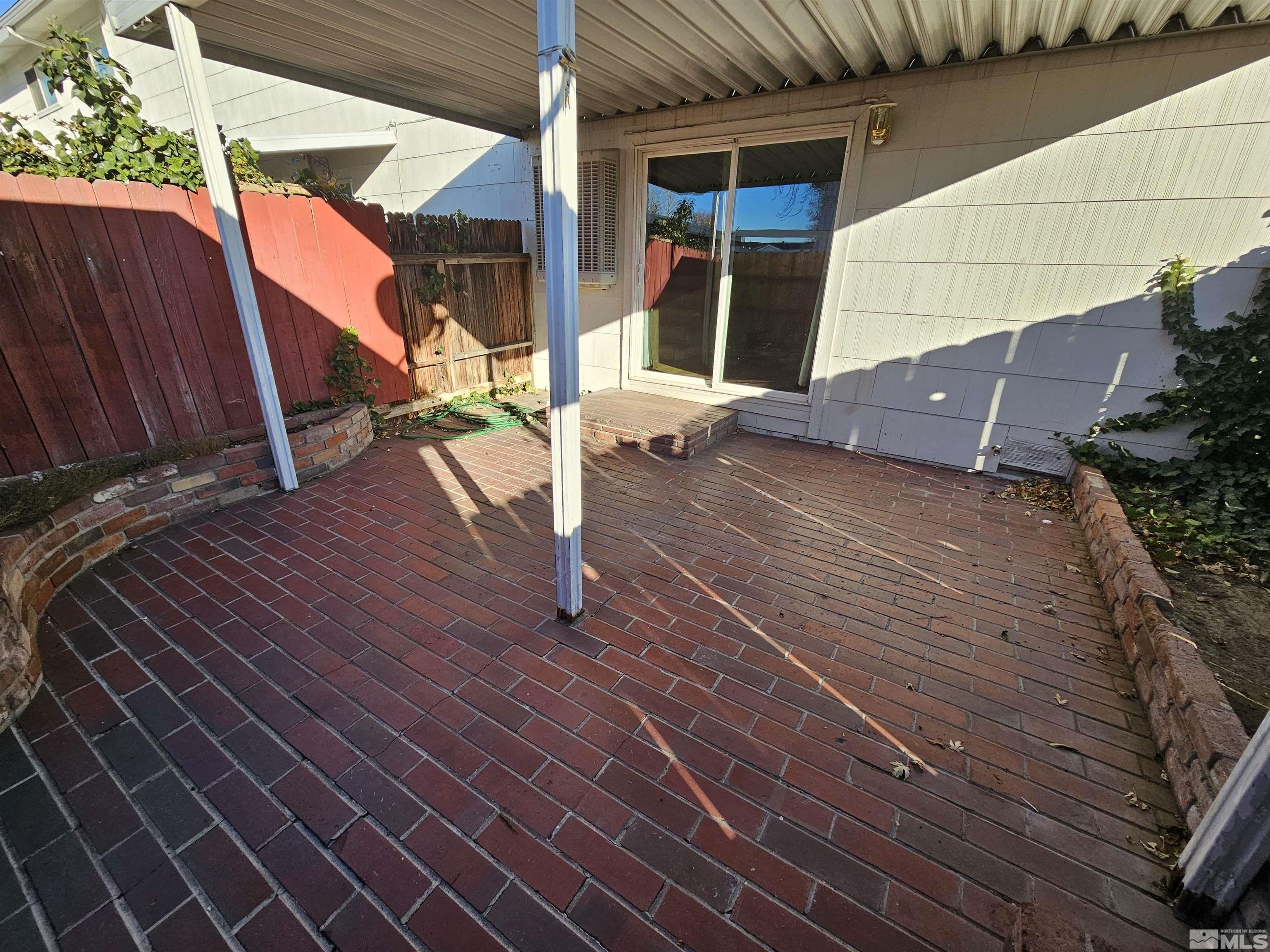 163 Smithridge Park Reno, NV 89502 - Photo 22 of 28 a view of a house with a wooden deck