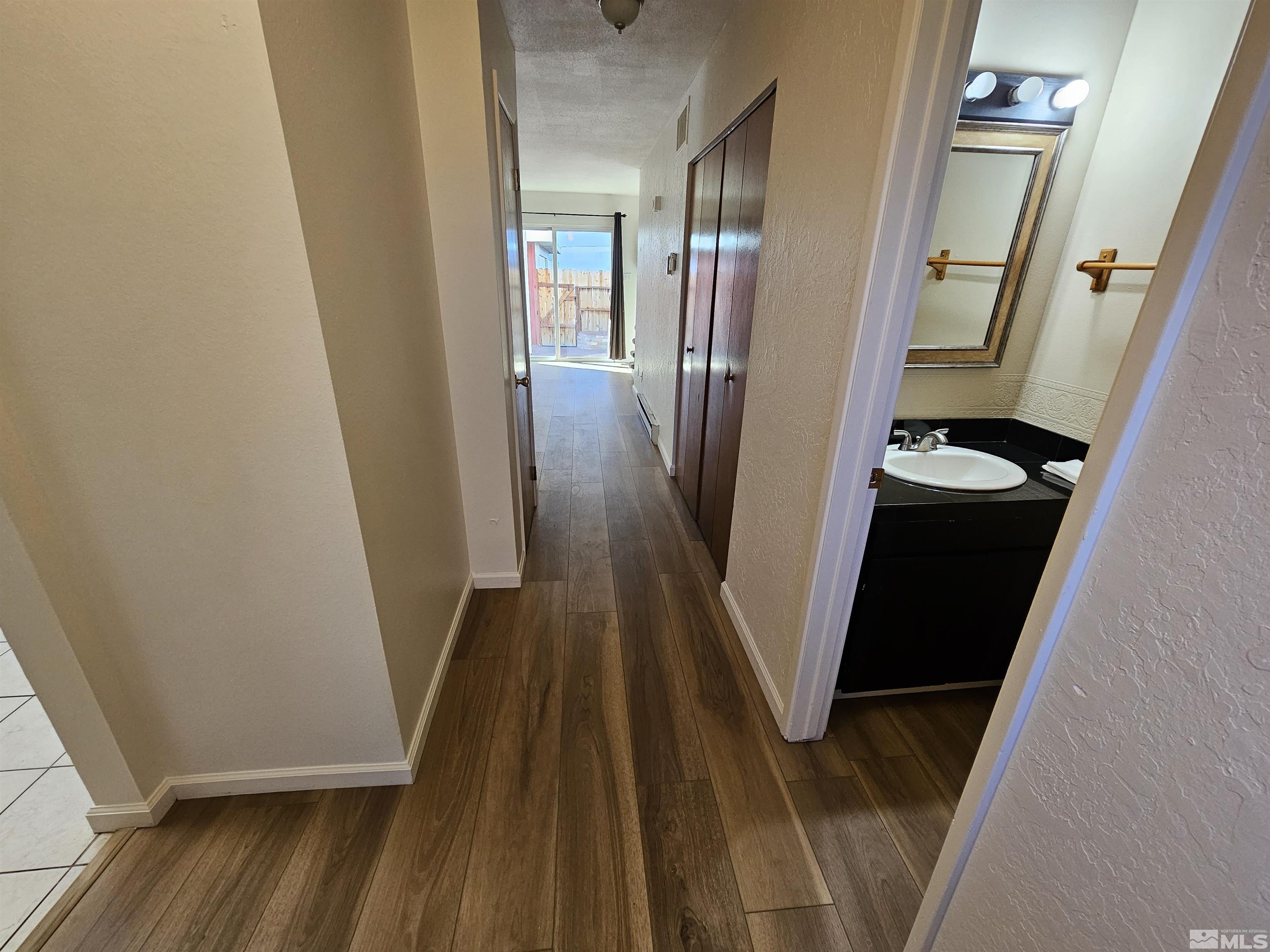 163 Smithridge Park Reno, NV 89502 - Photo 10 of 28 a view of a hallway with wooden floor and staircase