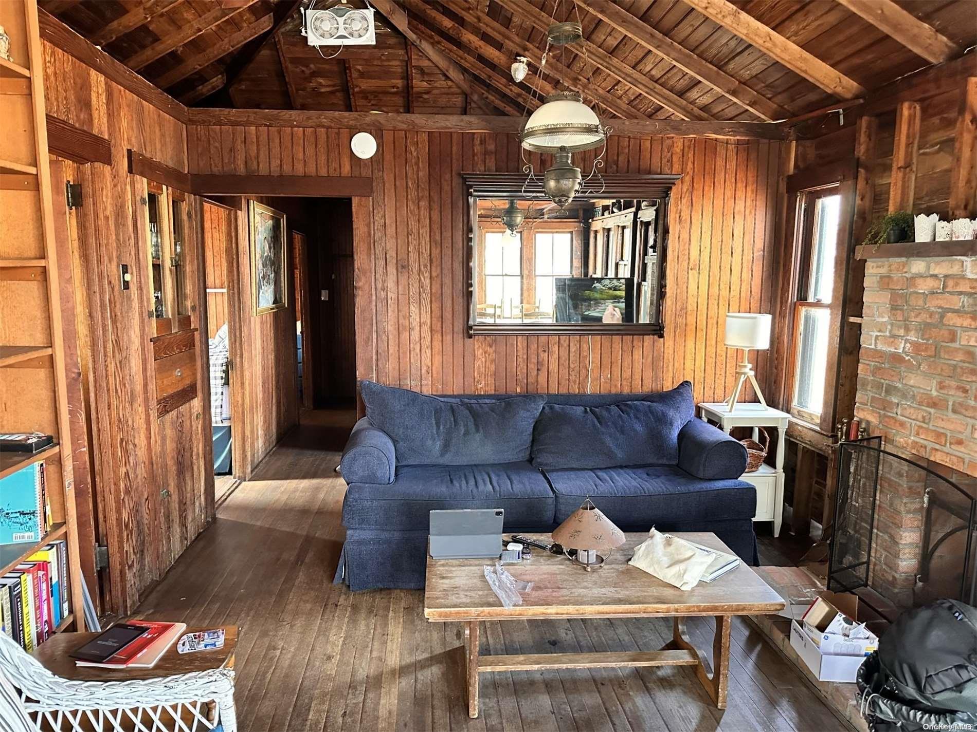315 Wilmot Road Ocean Beach, NY 11770 - Photo 4 of 8 a living room with furniture and a window