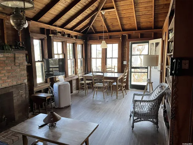 a view of a livingroom with furniture window and wooden floor