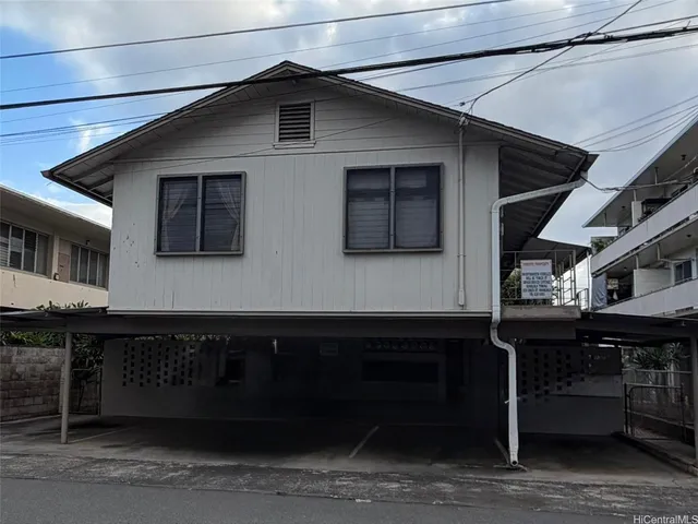 a front view of a house with glass windows