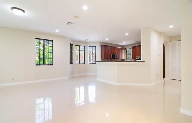 a view of a kitchen with a refrigerator cabinets and a window