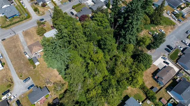 an aerial view of house with yard