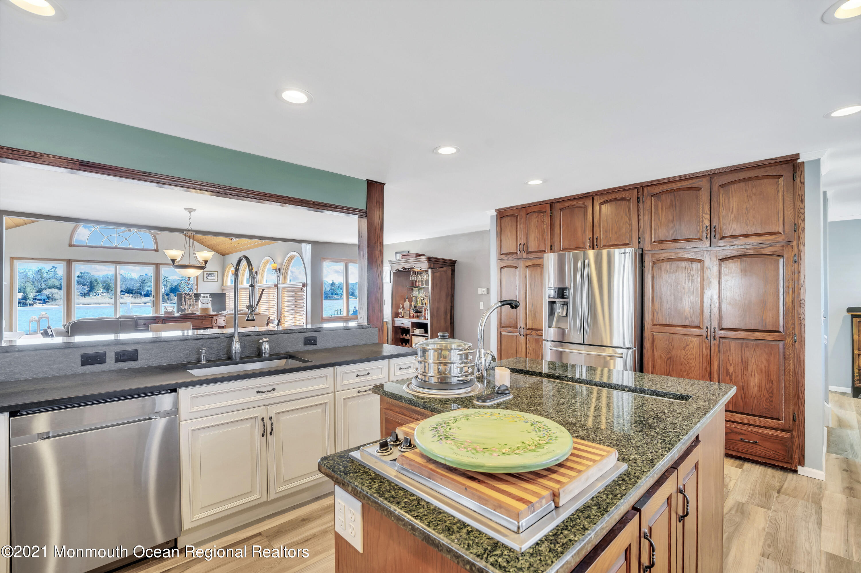 139 Riverside Drive North Brick, NJ 08724 - Photo 13 of 67 a kitchen with stainless steel appliances granite countertop a sink a stove and a refrigerator