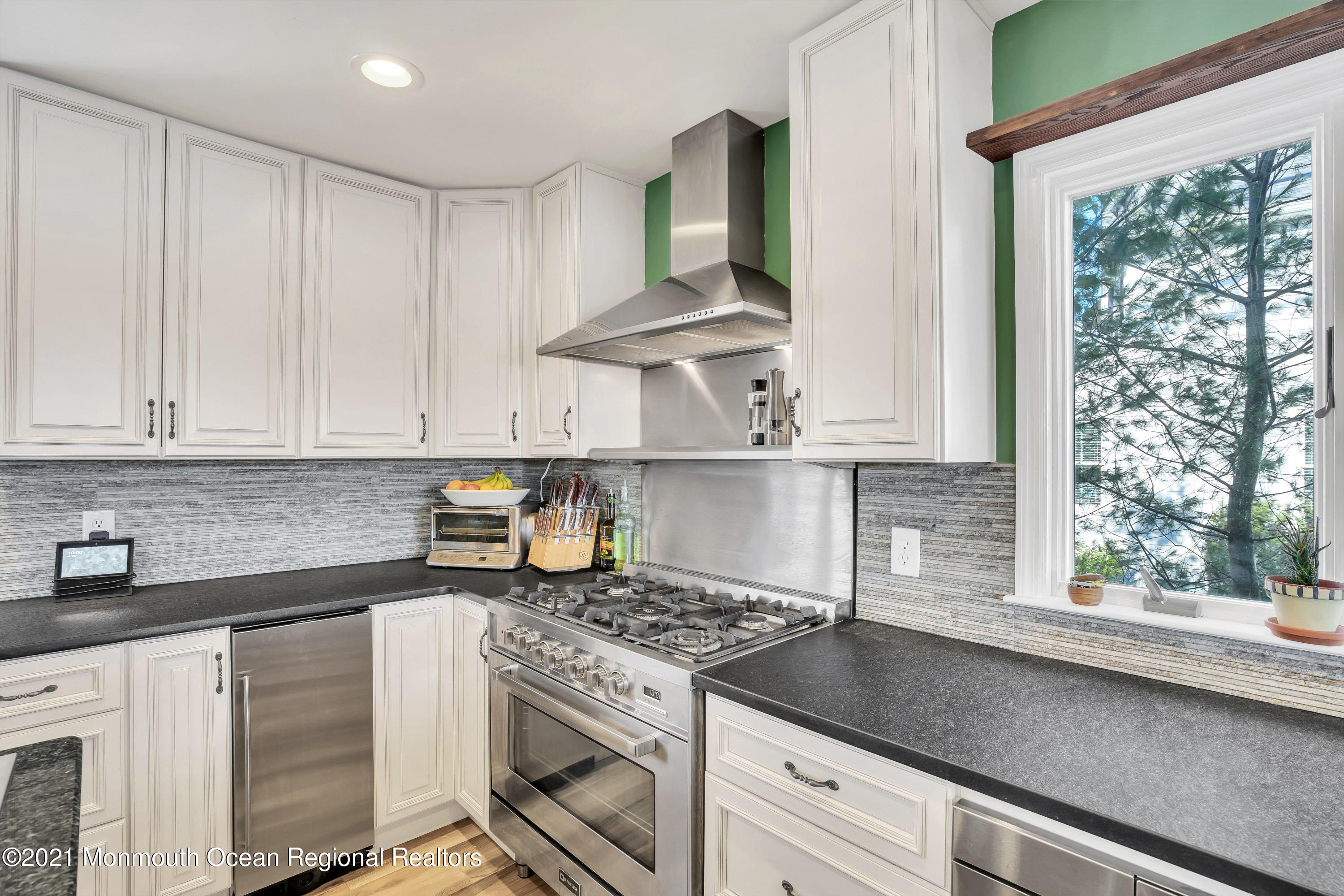 139 Riverside Drive North Brick, NJ 08724 - Photo 15 of 67 a kitchen with stainless steel appliances granite countertop a sink stove and cabinets