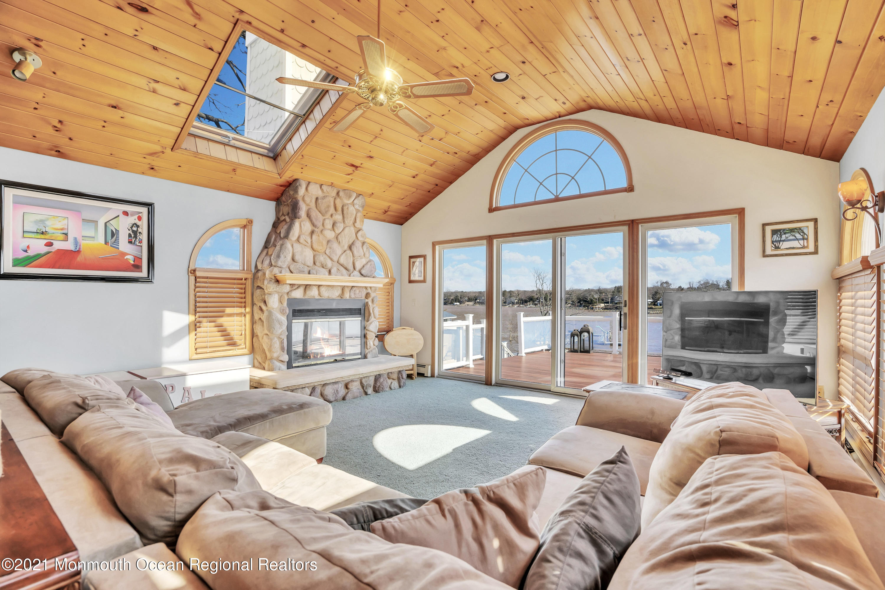 139 Riverside Drive North Brick, NJ 08724 - Photo 21 of 67 a living room with furniture a fireplace and a chandelier