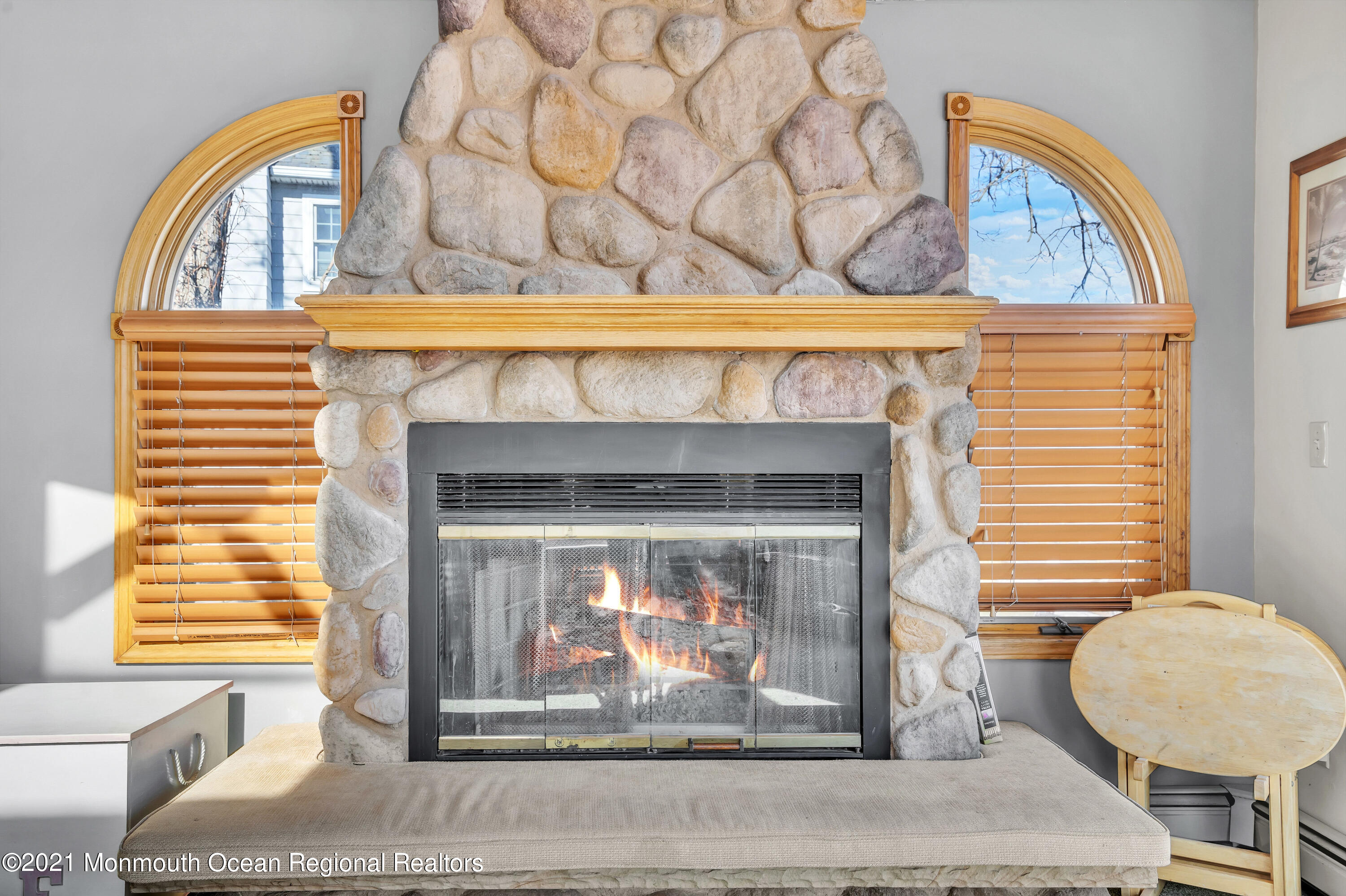 139 Riverside Drive North Brick, NJ 08724 - Photo 22 of 67 a living room with a fireplace and a table