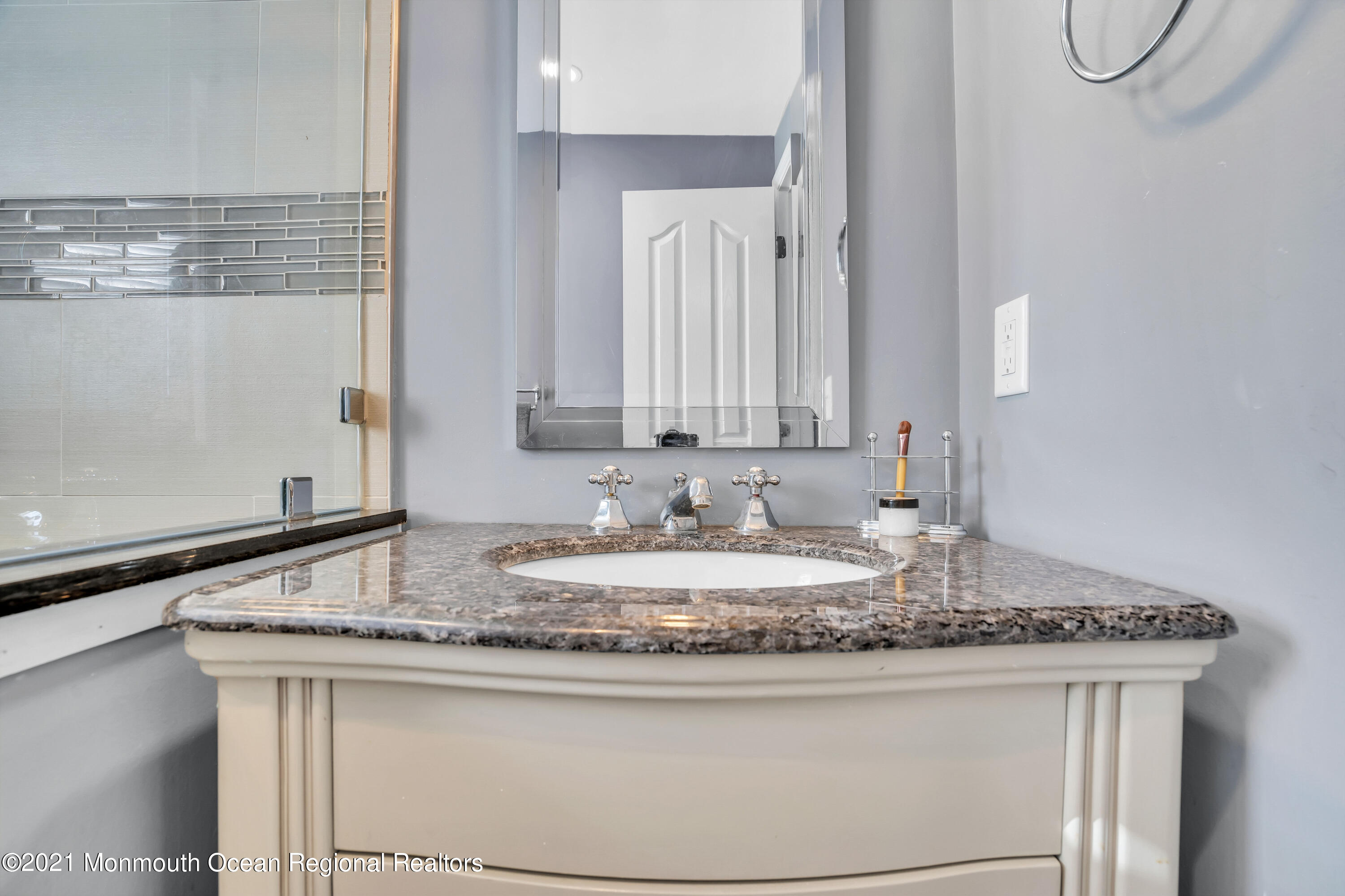 139 Riverside Drive North Brick, NJ 08724 - Photo 46 of 67 a bathroom with a granite countertop sink and a mirror