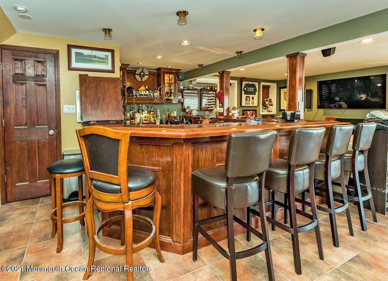 139 Riverside Drive North Brick, NJ 08724 - Photo 50 of 67 a dining table chairs counter space and a view of kitchen