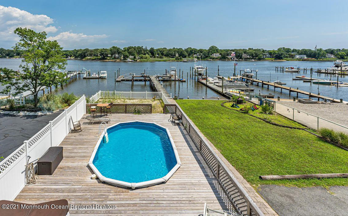 139 Riverside Drive North Brick, NJ 08724 - Photo 6 of 67 a view of a swimming pool with a lounge chairs