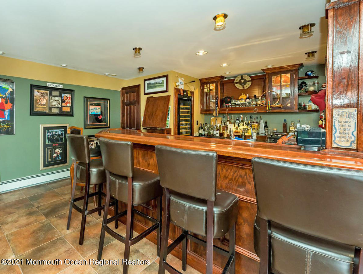139 Riverside Drive North Brick, NJ 08724 - Photo 51 of 67 a room with stainless steel appliances kitchen island granite countertop a table and chairs in it