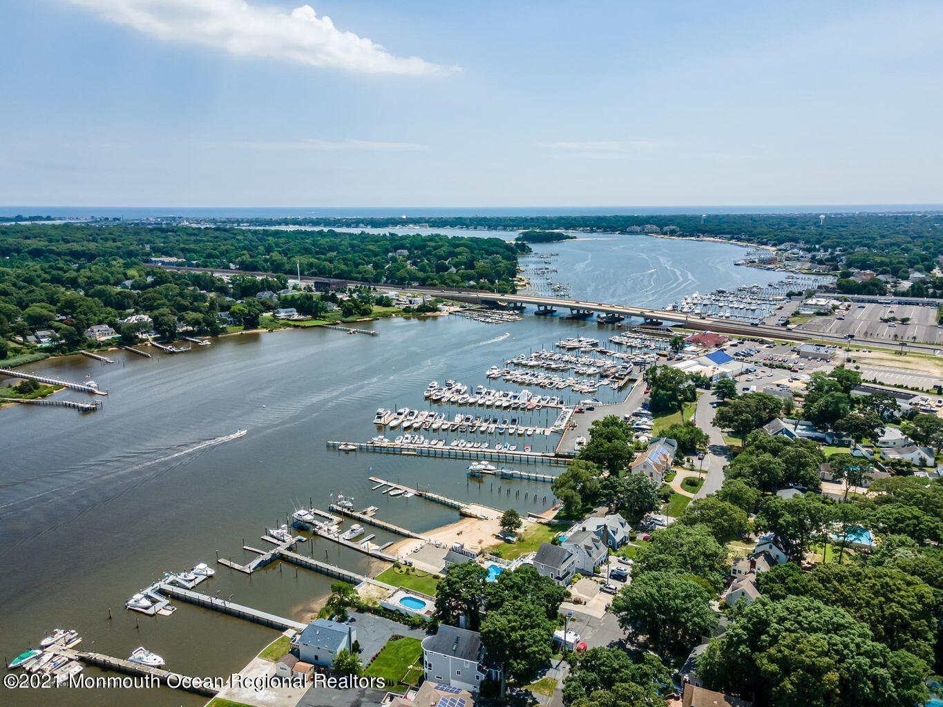 139 Riverside Drive North Brick, NJ 08724 - Photo 67 of 67 an aerial view of a city with lots of residential buildings and ocean view in back