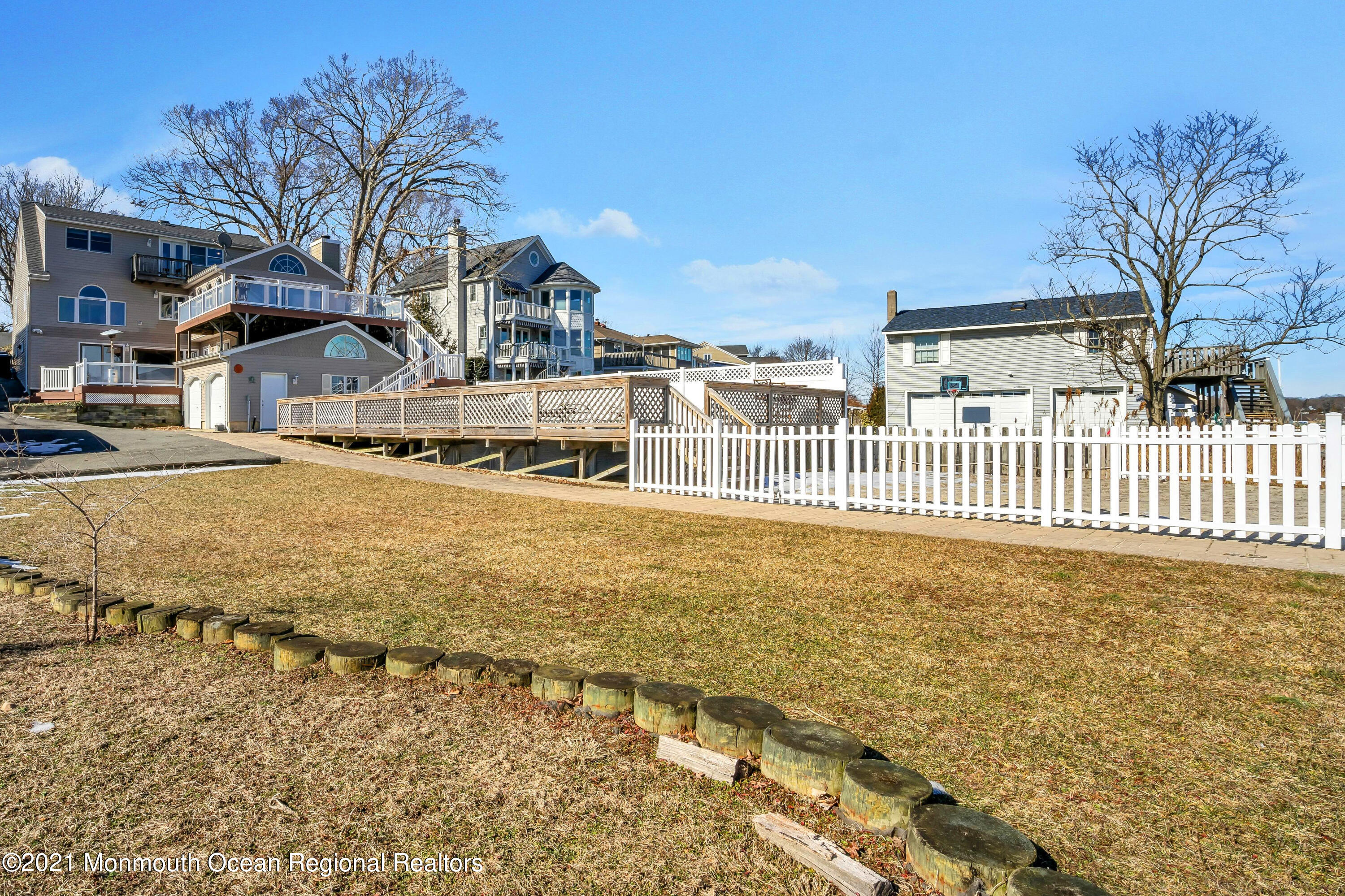 139 Riverside Drive North Brick, NJ 08724 - Photo 8 of 67 a view of a house with a yard covered with snow in the background