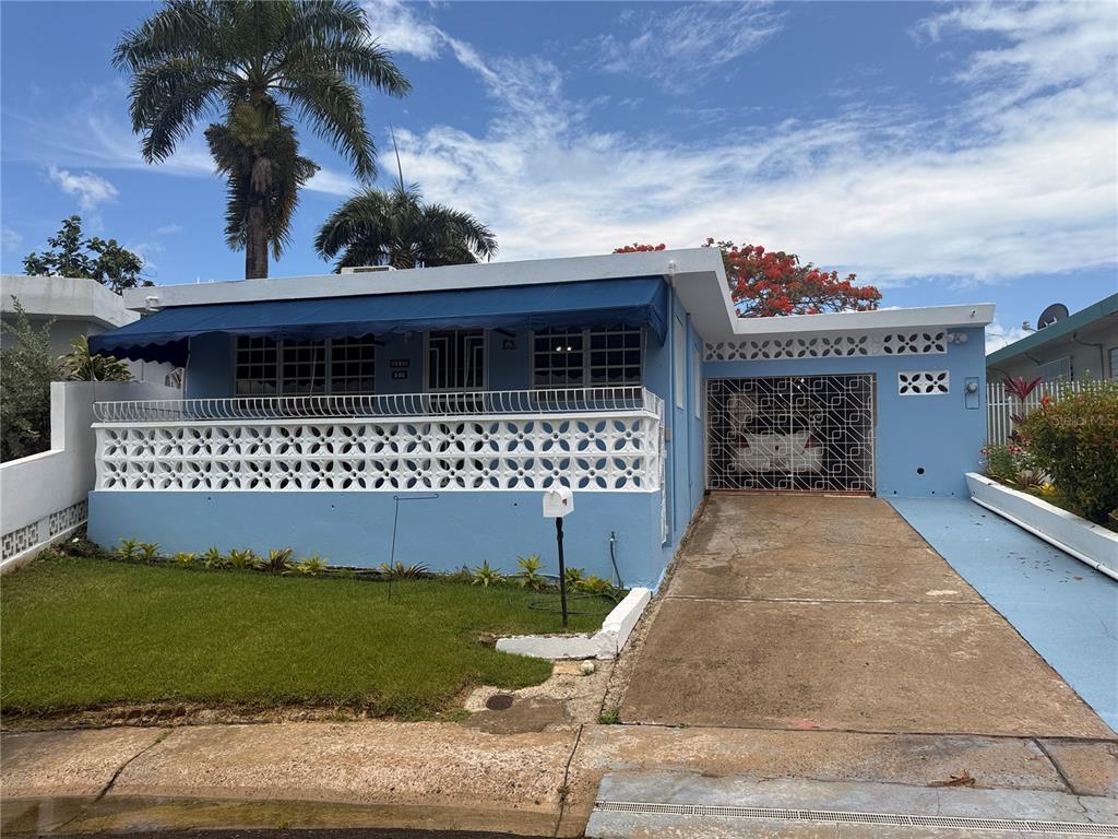 15 Sierra Bayamon Bayamon, Bayamón 00961 - Photo 1 of 1 a front view of a house with a garden