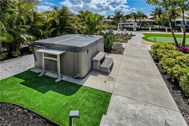 a view of a backyard with sitting area