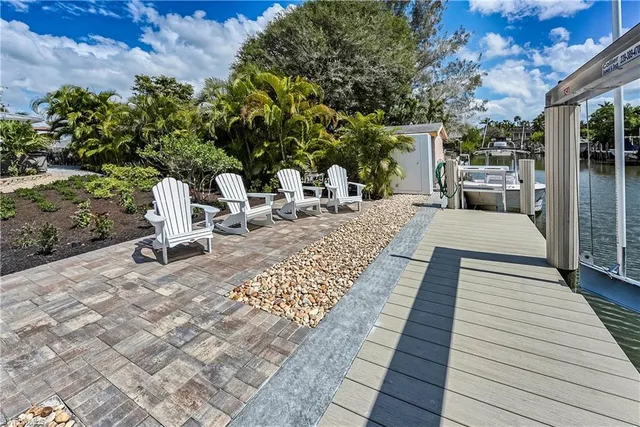 a view of a backyard with sitting area