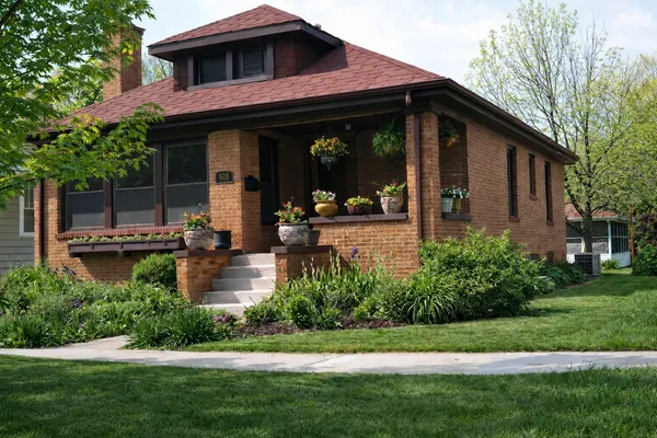 a view of a house with garden and plants