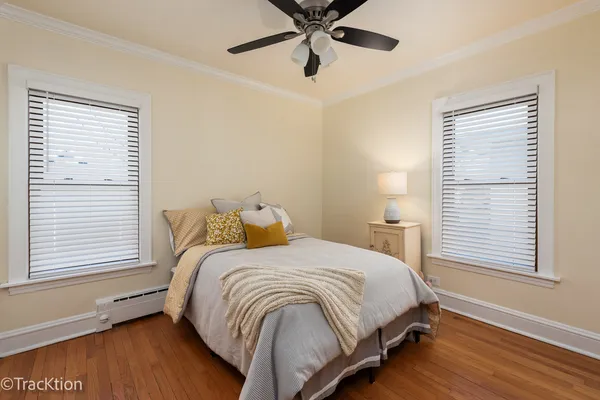 a bedroom with a bed and window