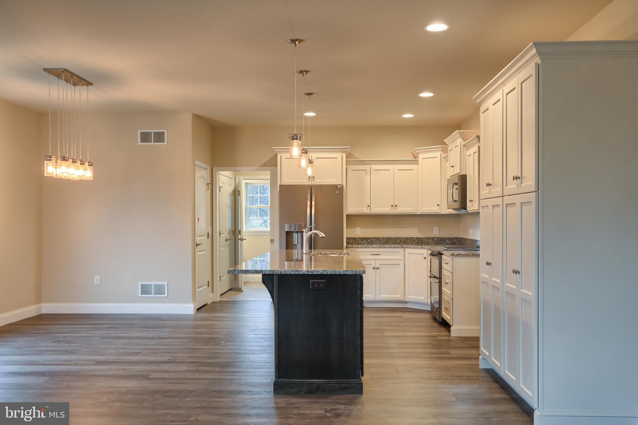26 Rolling Meadow Road Lebanon, PA 17046 - Photo 12 of 29 a large kitchen with granite countertop a large counter top appliances and cabinets