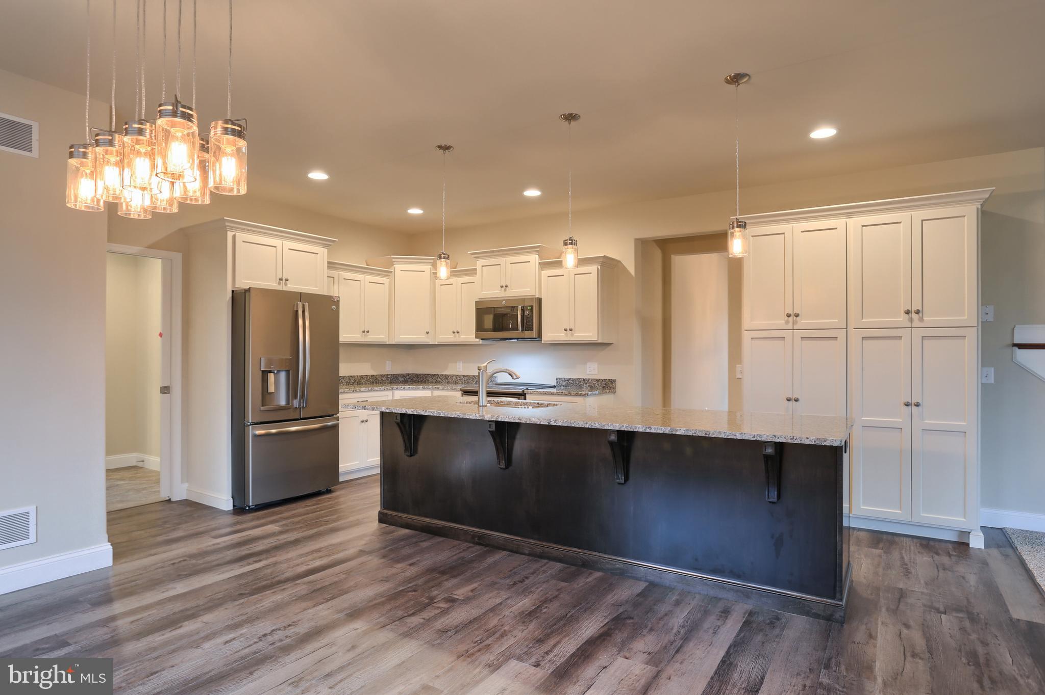 26 Rolling Meadow Road Lebanon, PA 17046 - Photo 15 of 29 a kitchen with stainless steel appliances granite countertop a refrigerator and a sink