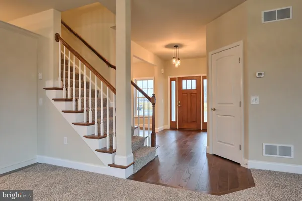 a view interior of a house with wooden floor and stairs