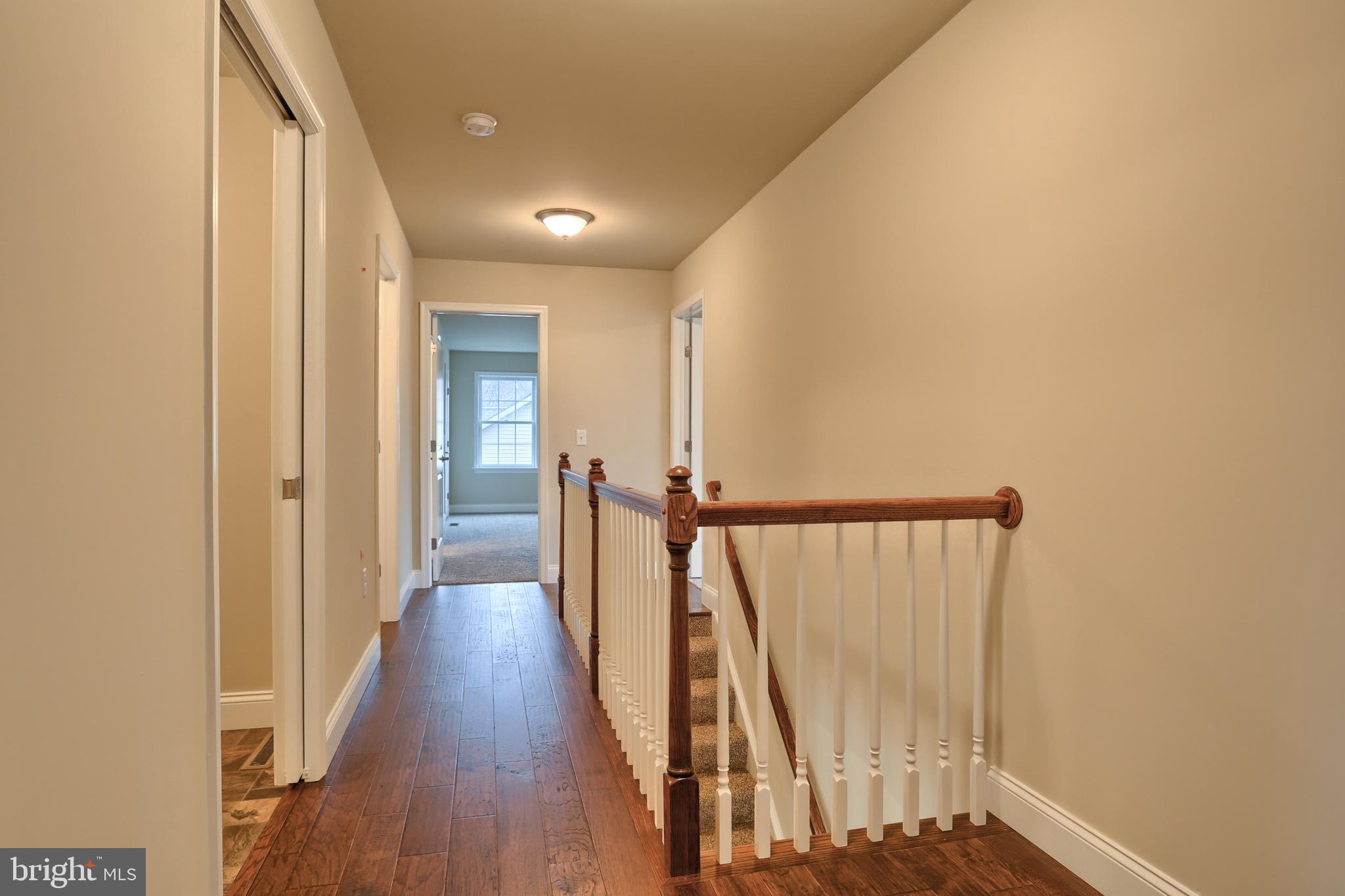 26 Rolling Meadow Road Lebanon, PA 17046 - Photo 24 of 29 a view of a hallway with wooden floor and staircase