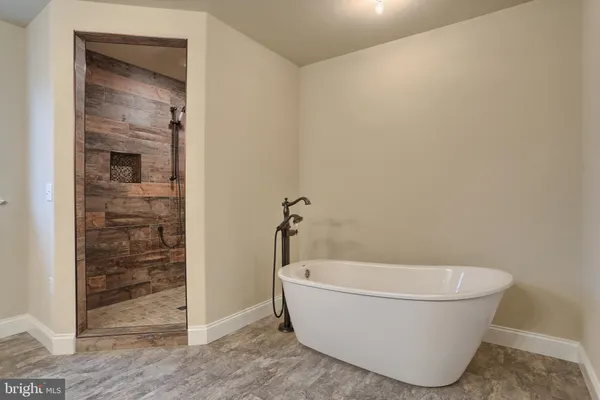 a white bath tub sitting in a bathroom