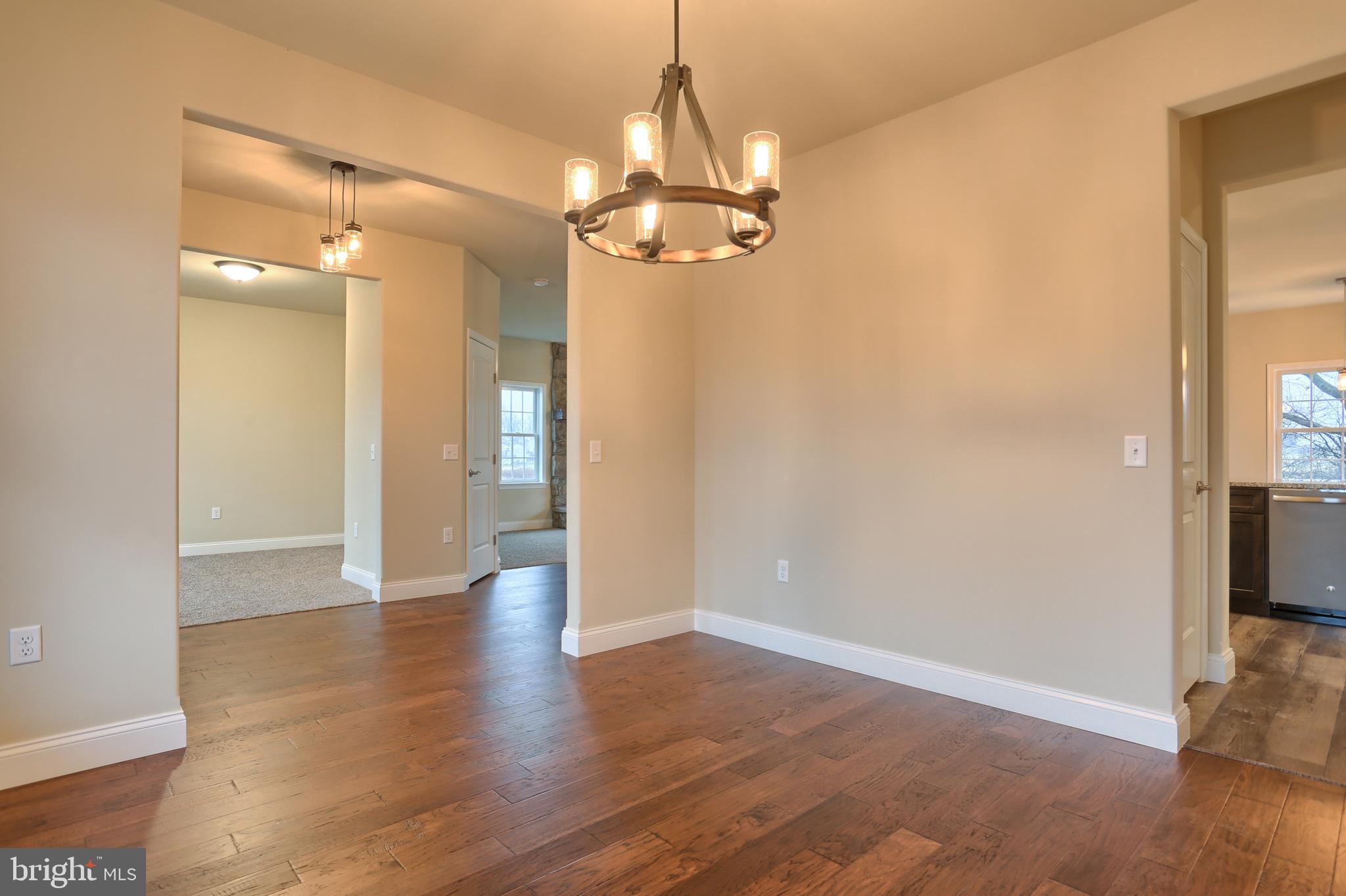 26 Rolling Meadow Road Lebanon, PA 17046 - Photo 7 of 29 wooden floor in an empty room with a mirror