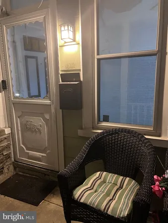 a view of a door and chair in a room