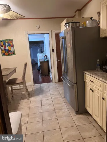 a kitchen with stainless steel appliances a refrigerator and microwave