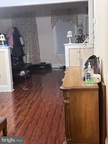 a living room with table and chairs