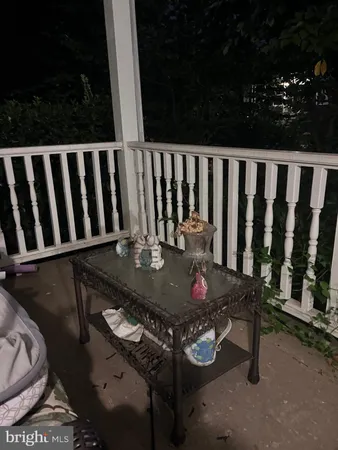 a view of balcony with furniture