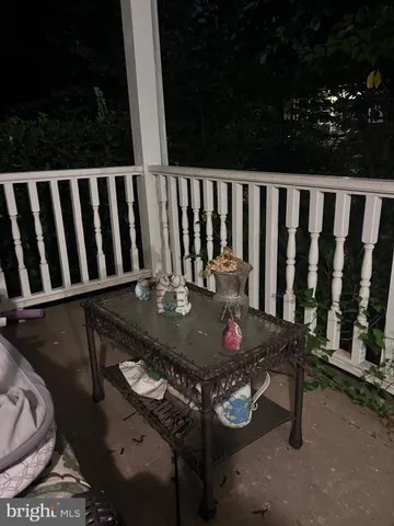 a view of balcony with furniture