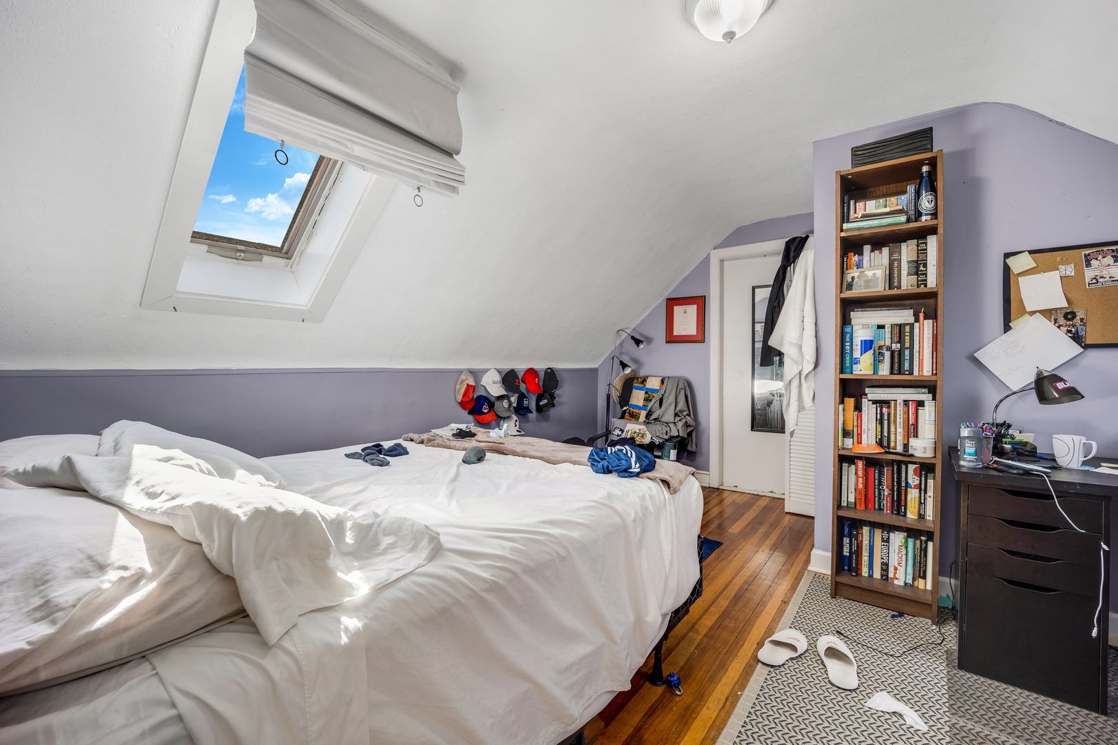 Undisclosed Address Chicago, IL 60657 - Photo 12 of 13 a bedroom with a bed and a book shelf