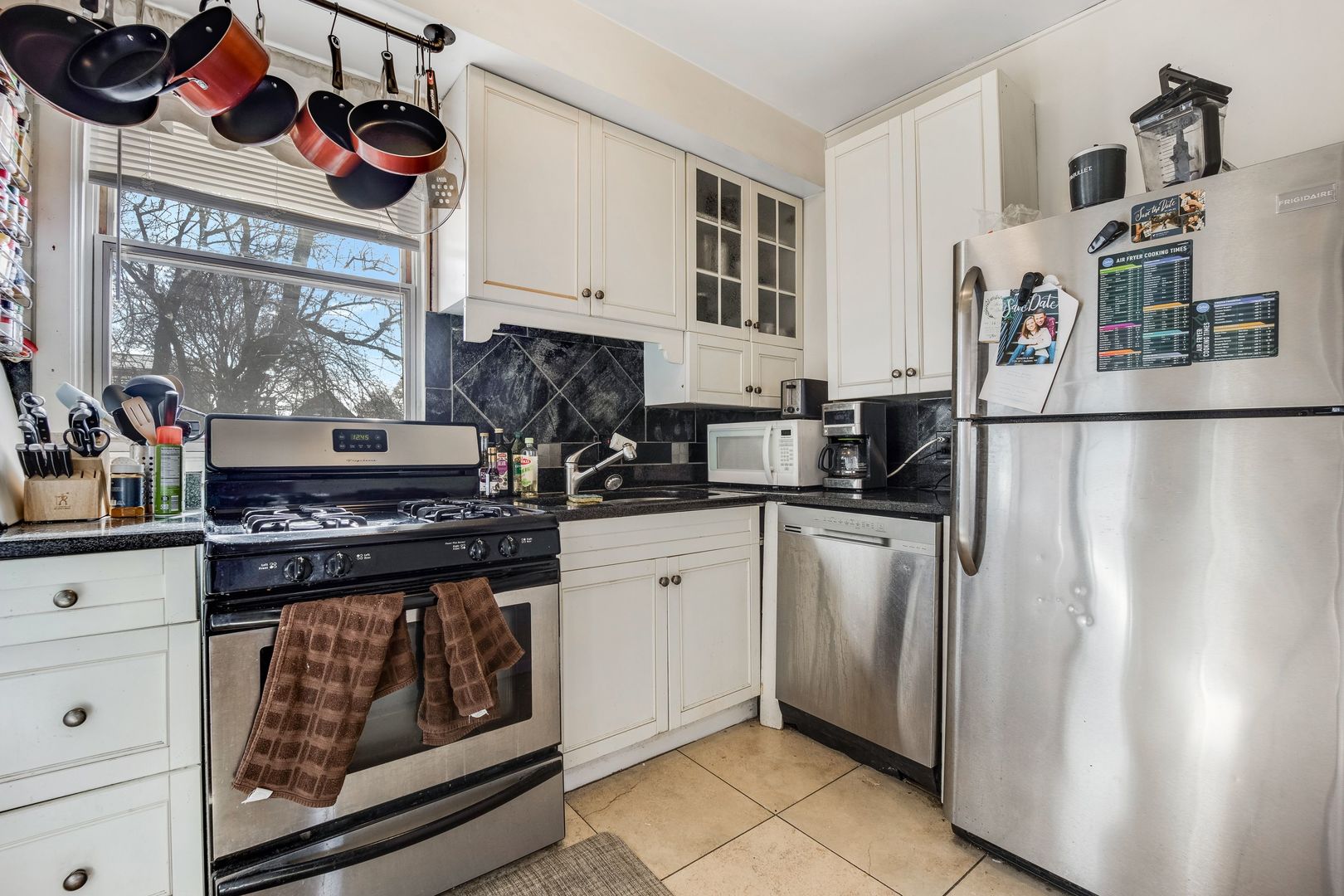 Undisclosed Address Chicago, IL 60657 - Photo 3 of 13 a kitchen with stainless steel appliances granite countertop a refrigerator and a stove