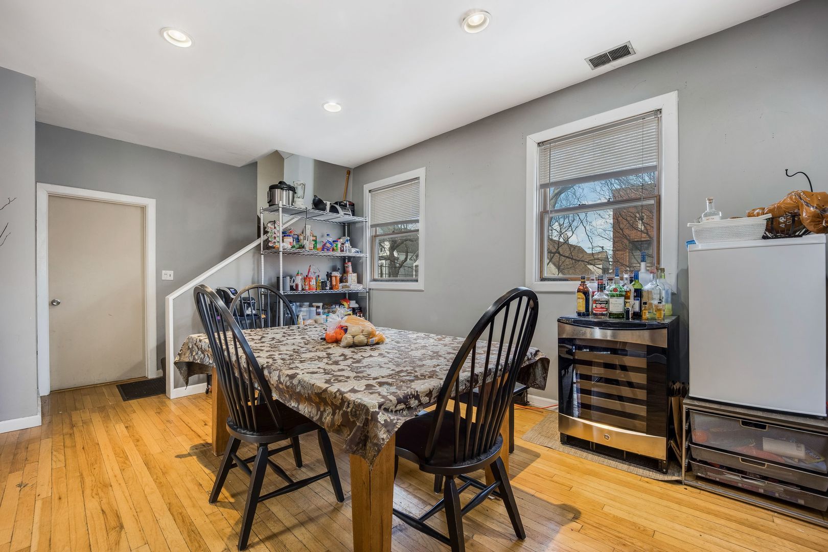 Undisclosed Address Chicago, IL 60657 - Photo 4 of 13 a view of a dining room with furniture and wooden floor