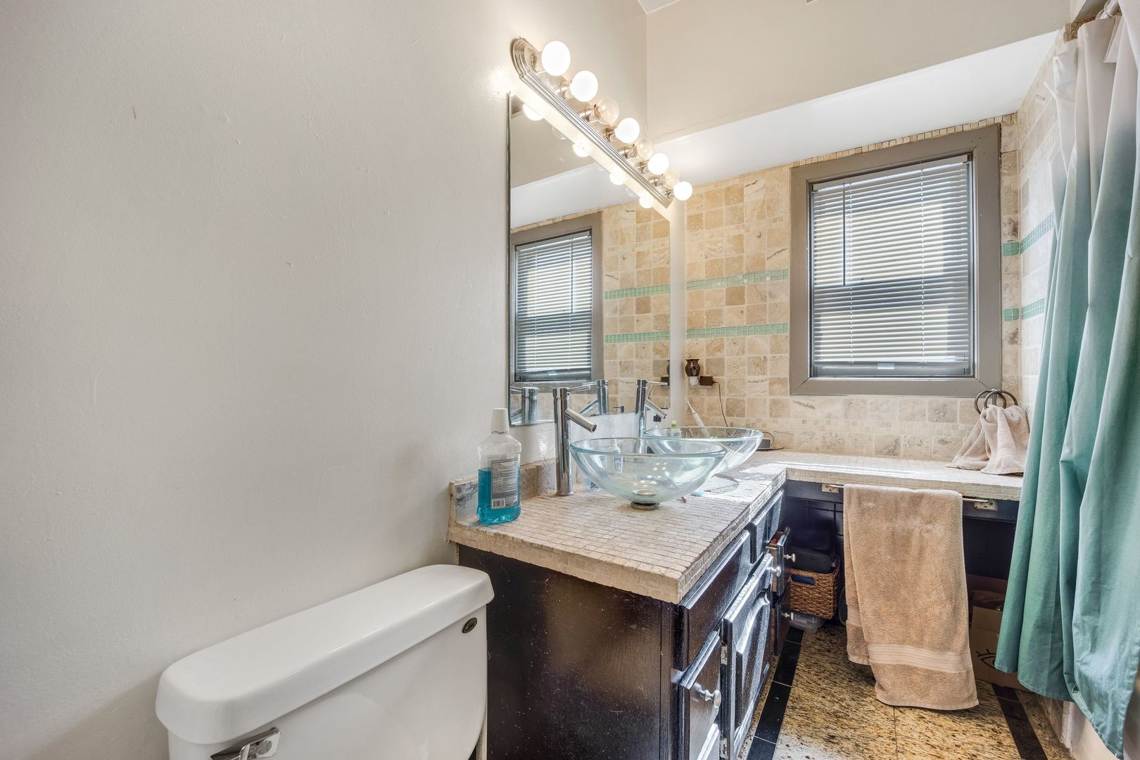 Undisclosed Address Chicago, IL 60657 - Photo 5 of 13 a bathroom with a sink toilet and mirror